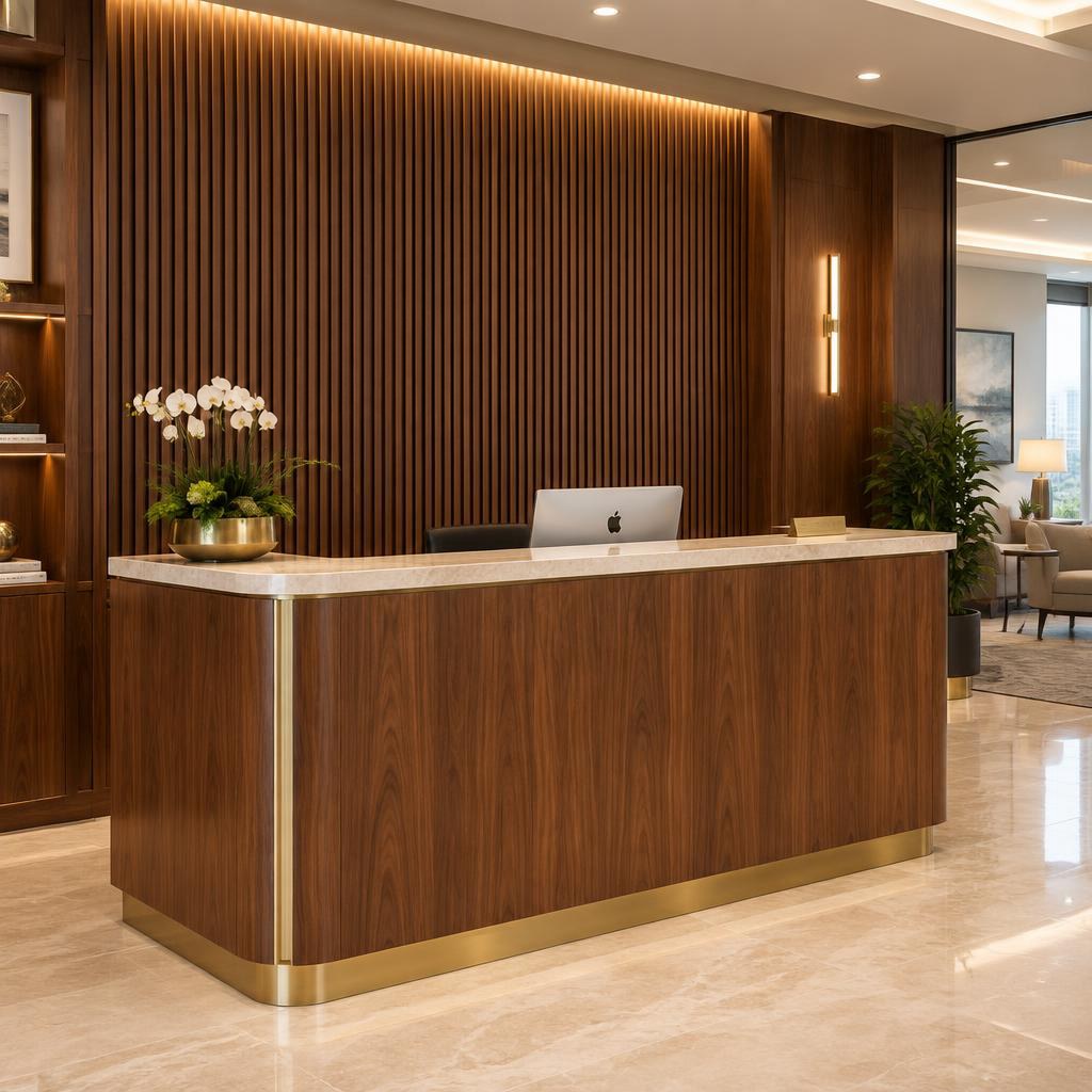 Custom walnut reception desk with fluted wood feature wall and brass accents